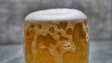 Macro Shot Of Pouring Beer Into Glassの写真素材