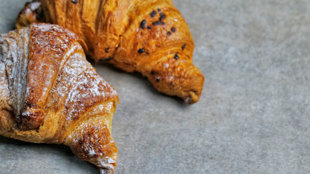 Chocolate croissant, croissant with chocolate crumbs, two croissant, close-upの写真素材