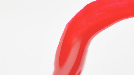 Brush with nail polish and blot on white background