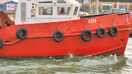 red fishing boat, boat sailing in the sea, fishing, boat sailing from the port to the open seaの写真素材