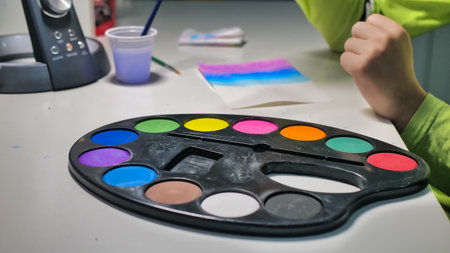 Childrens watercolor box on a light backgroundの写真素材