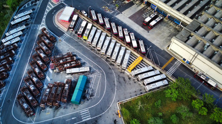 Bus depot red buses top-down view aerial drone shot