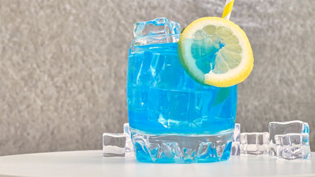 blue lemonade in a glass with iceの写真素材