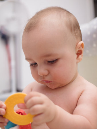 portrait of a child playing with a toyの写真素材