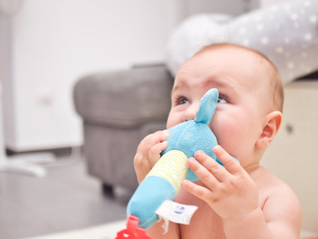 portrait of a child playing with a toy