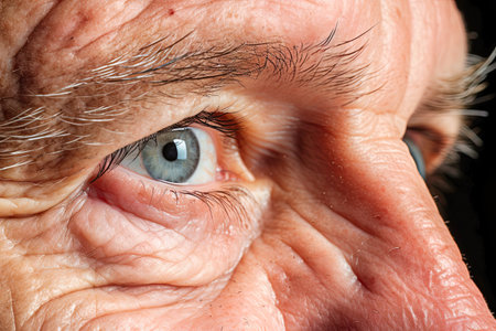 close-up macro shot of a ninety-year-old man with wrinkles close-up.の素材