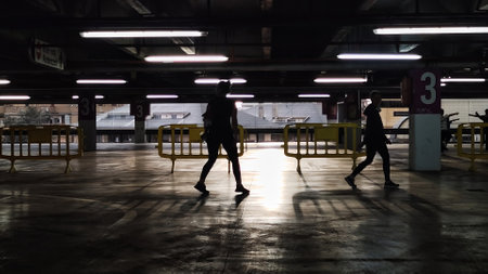 people walk through the closed parking.