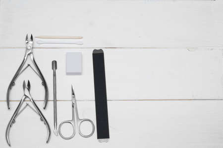 Set of manicure scissors, clipper, spatula, for nail care on a grey background. Professional pedicure equipment for teachers, beauty salons or home use. Manicure on self-isolation. .の写真素材