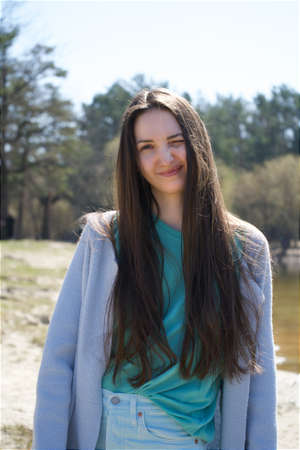 portrait of happy young woman at park. High quality photoの写真素材