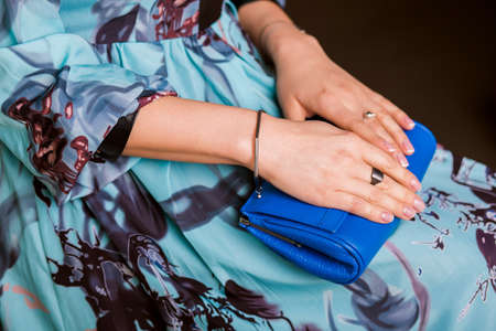 On the beautiful female hands bracelet and ring, made of dark silver. Exquisite ladies summer accessoriesの写真素材