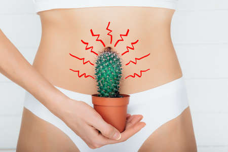 woman dressed in underwear, suffering from stomach ache , gastritis or menstruation, stomach trouble...