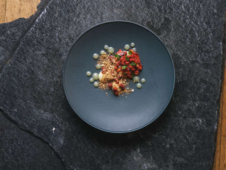 Haute high end cuisine gourmet exquisite dish, creative restaurant meal concept on the black stone...