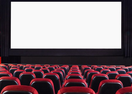 Empty cinema auditorium with screen and seats