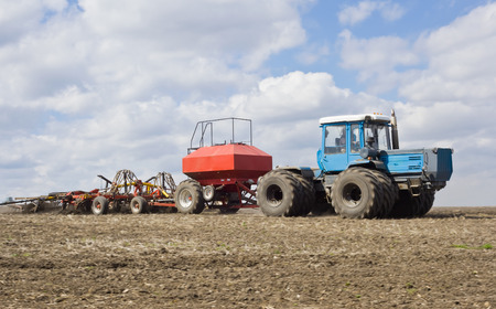 Big powerful traktor on the field