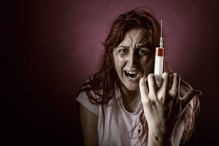 Weeping Woman addict. Focus on the syringeの写真素材