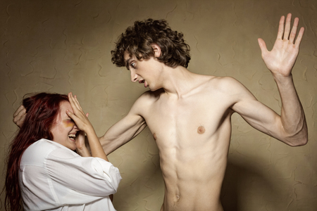Woman victim of domestic violence and abuse. Husband beats his wifeの写真素材