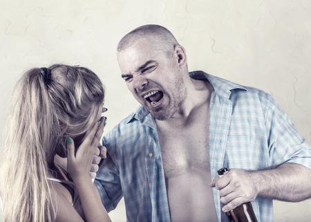 Woman victim of domestic violence and abuse. Husband beats his wifeの写真素材