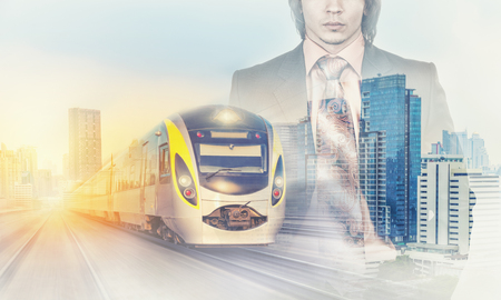 Double Exposure of a businessman and big city with trainの写真素材