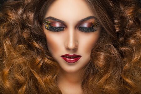 Closeup portrait of a beautiful young woman model with glamor make-upの写真素材