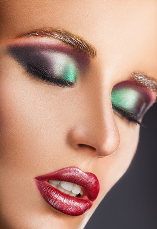 Make-up. Close-up face of a beautiful sexy woman with fashion make-upの写真素材