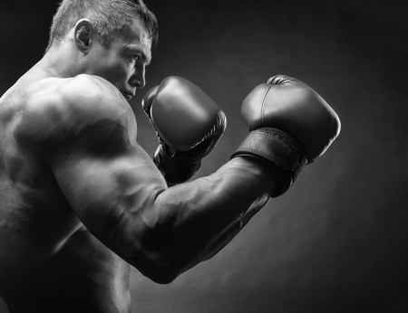 Boxing concept. Black and white image. Boxer with boxing gloves before a fightの写真素材