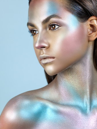 Fashion model woman with trendy metallic make-up. Glitter vivid makeup. Fashion makeupの写真素材