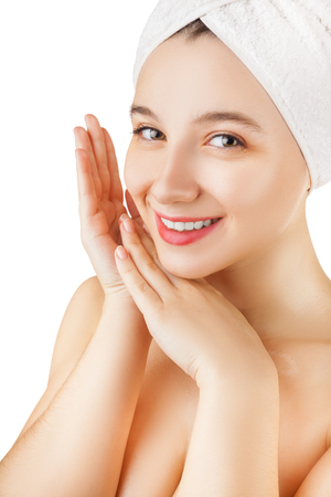 Beauty and healthy concept. Close-up of young girl caring for her face isolated on white backgroundの写真素材