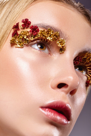 Glamour portrait of beautiful woman model with fashion makeup. Close-up of trendy make-upの写真素材