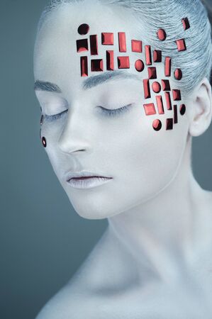 High fashion model. Girl in white makeup and accessories. Portrait of beautiful sexy woman, white skin make-up. Art design makeupの写真素材