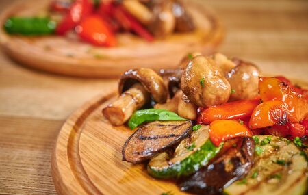 Grilled vegetables mix on wooden plateの写真素材