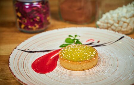 Delicious lemon tart with raspberries dressingの写真素材