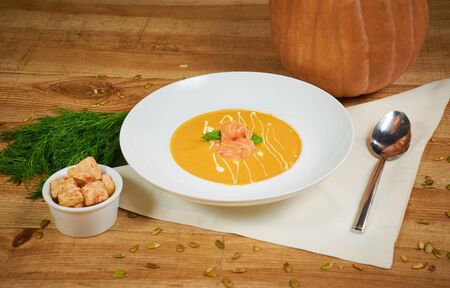 Pumpkin soup with sliced salmonの写真素材