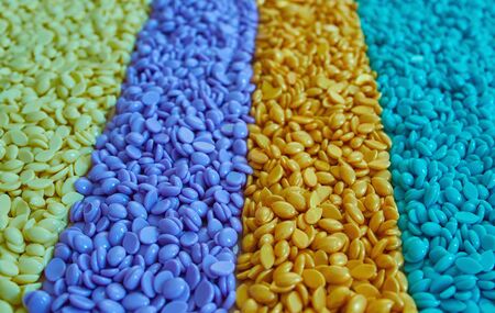 Granules for depilation. Abstract beautiful backdrop. Wallpaper. Granules for hair removal. Colorful wax granulesの写真素材