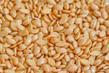 Abstract beautiful backdrop. Wallpaper. Granules for hair removal. Golden wax granulesの写真素材