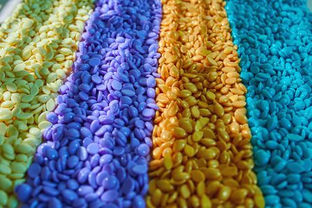 Granules for depilation. Abstract beautiful backdrop. Wallpaper. Granules for hair removal. Colorful wax granulesの写真素材