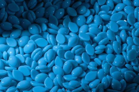 Abstract beautiful backdrop. Wallpaper. Granules for hair removal. Blue wax granulesの写真素材