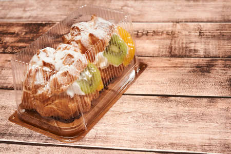 small cake in a transparent box for sale in stores