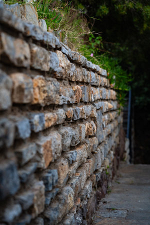 Old stone wall in the park, close up shot with selective focus
