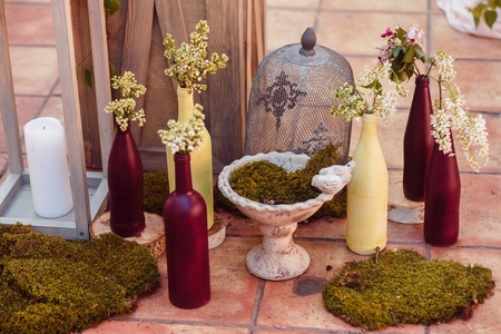 Wedding decoration ceremony. Fresh flowers in vasesの写真素材