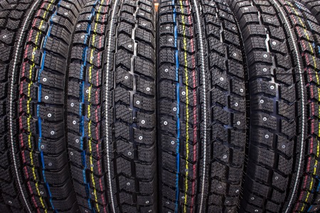 New winter studded tire sold in the shop (close up)の写真素材