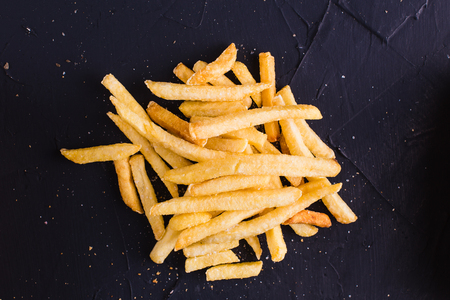 French fries on a dark background (top view)の写真素材
