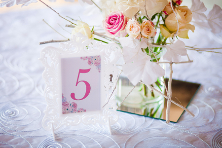 Wedding decoration. Room in a patterned frame on the table for guests. Closeの写真素材