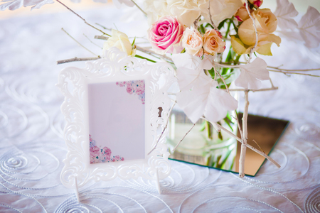 Wedding decoration. Room in a patterned frame on the table for guests. Closの写真素材