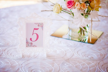 Wedding decoration. Room in a patterned frame on the table for guests. Closeの写真素材