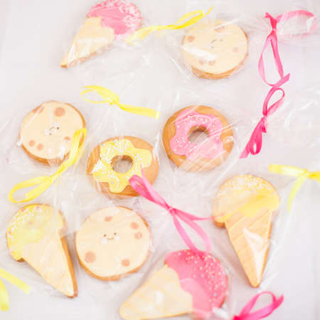 Painted cakes in the form of ice cream and donutsの写真素材