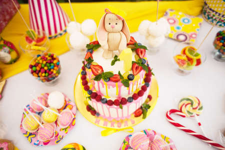 The two-storey cake for children's birthday with a hareの写真素材
