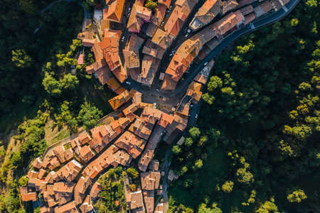 Scansano town from above. Aerial beautiful view. Geometrical streets and roads. Tiled roofs and trees on the hills. Scansano small city in Tuscany, Italy.の写真素材