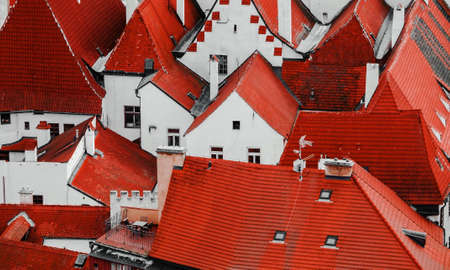 Tiled roofs of the houses with white walls from above view. Beautiful perspective picture. Postcard...