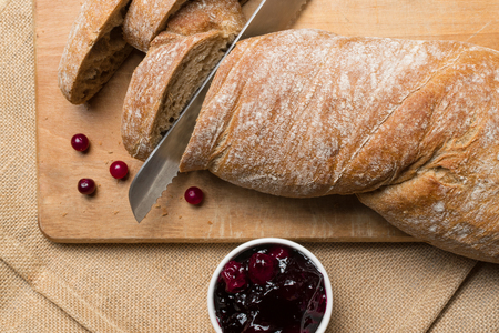 Ciabatta bread with a side of fresh cherry jamの写真素材