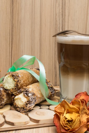 cannoli sweets with rose decorationの写真素材